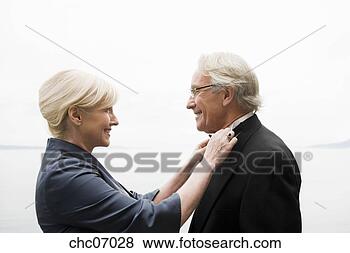 Stock Photo - senior woman adjusting 
husband’s bowtie. 
fotosearch - search 
stock photos, 
pictures, images, 
and photo clipart