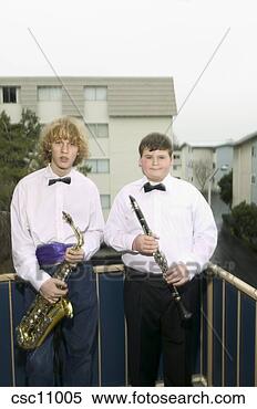 Stock Image - young boys in 
bowties holding 
musical instruments. 
fotosearch - search 
stock photos, 
pictures, images, 
and photo clipart
