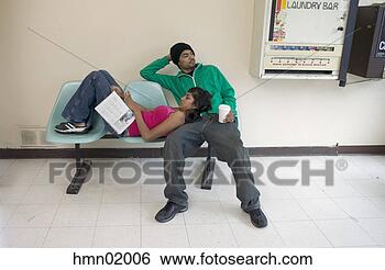 Stock Photo - african couple 
waiting in laundromat. 
fotosearch - search 
stock photos, 
pictures, images, 
and photo clipart