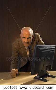 Stock Photograph - angry businessman 
pounding desk. 
fotosearch - search 
stock photos, 
pictures, images, 
and photo clipart