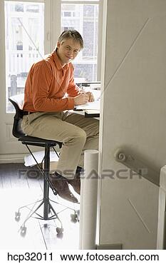 Stock Photography - architect sitting 
at drafting table. 
fotosearch - search 
stock photos, 
pictures, images, 
and photo clipart