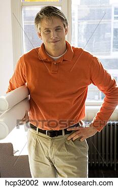 Stock Photo - architect standing 
with blueprints. 
fotosearch - search 
stock photos, 
pictures, images, 
and photo clipart