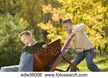 Stock Photo - brothers playing 
with wheelbarrow. 
fotosearch - search 
stock photos, 
pictures, images, 
and photo clipart