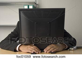 Stock Photograph - businessman hiding 
behind computer 
monitor. fotosearch 
- search stock 
photos, pictures, 
images, and photo 
clipart