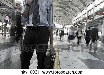 Stock Photography - businessman holding 
briefcase. fotosearch 
- search stock 
photos, pictures, 
images, and photo 
clipart