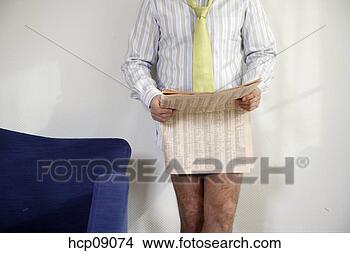 Stock Photo - businessman in 
semi-dress reading 
newspaper. fotosearch 
- search stock 
photos, pictures, 
images, and photo 
clipart
