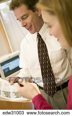 Stock Photo - businesspeople 
discussing graphs. 
fotosearch - search 
stock photos, 
pictures, images, 
and photo clipart