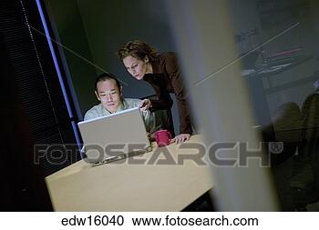 Stock Photography - businesspeople 
using laptop. 
fotosearch - search 
stock photos, 
pictures, images, 
and photo clipart
