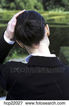 Picture - businesswoman 
smoothing her 
hair. fotosearch 
- search stock 
photos, pictures, 
images, and photo 
clipart