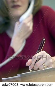 Stock Photo - businesswoman 
writing at desk. 
fotosearch - search 
stock photos, 
pictures, images, 
and photo clipart