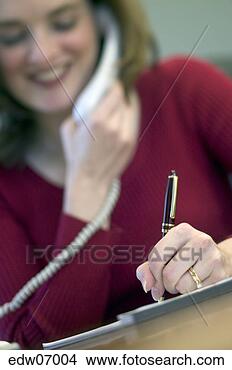 Stock Photo - businesswoman 
writing at desk. 
fotosearch - search 
stock photos, 
pictures, images, 
and photo clipart