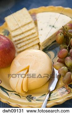 Stock Photography - close-up of cheese 
plate with fruit 
and crackers. 
fotosearch - search 
stock photos, 
pictures, images, 
and photo clipart