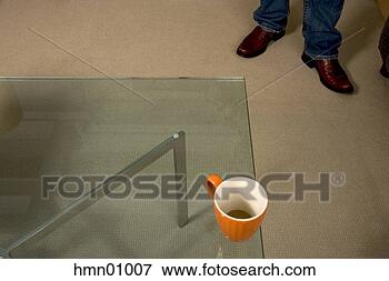Picture - coffee cup near 
edge of glass 
table. fotosearch 
- search stock 
photos, pictures, 
images, and photo 
clipart