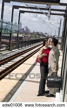Stock Photo - couple kissing 
goodbye at train 
station. fotosearch 
- search stock 
photos, pictures, 
images, and photo 
clipart