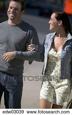 Stock Photograph - couple walking 
together. fotosearch 
- search stock 
photos, pictures, 
images, and photo 
clipart