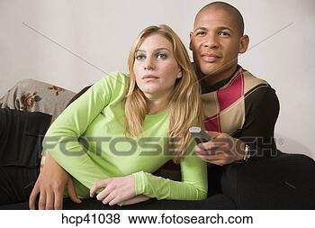 Stock Photo - couple watching 
television. fotosearch 
- search stock 
photos, pictures, 
images, and photo 
clipart
