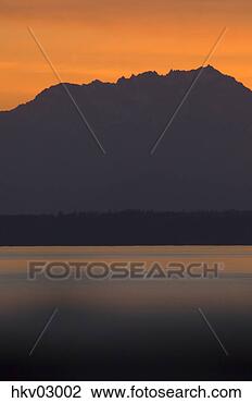Stock Photo - dusk over mountains 
and lake,  puget 
sound and olympic 
mountains. fotosearch 
- search stock 
photos, pictures, 
images, and photo 
clipart