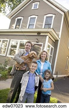 Stock Photo - family standing 
outside their 
house. fotosearch 
- search stock 
photos, pictures, 
images, and photo 
clipart