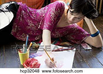Stock Photo - female designer 
sketching on floor. 
fotosearch - search 
stock photos, 
pictures, images, 
and photo clipart