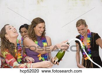 Stock Photography - friends opening 
bottle of champagne. 
fotosearch - search 
stock photos, 
pictures, images, 
and photo clipart