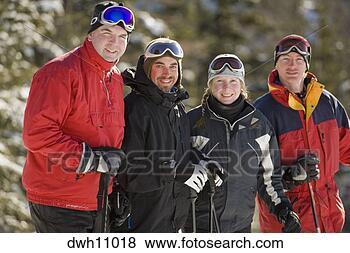 Stock Photo - friends in ski 
gear smiling in 
snow. fotosearch 
- search stock 
photos, pictures, 
images, and photo 
clipart