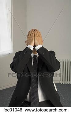Stock Photo - frustrated businessman 
with head in hands. 
fotosearch - search 
stock photos, 
pictures, images, 
and photo clipart