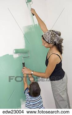 Stock Photo - hispanic mother 
and son painting 
wall together. 
fotosearch - search 
stock photos, 
pictures, images, 
and photo clipart