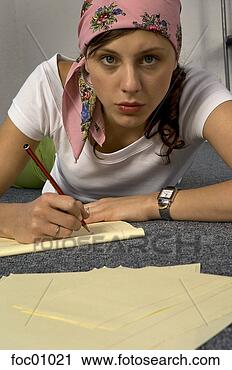 Stock Photography - hispanic woman 
writing on notepad. 
fotosearch - search 
stock photos, 
pictures, images, 
and photo clipart