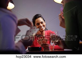 Stock Photo - hispanic women 
playing poker 
with friends. 
fotosearch - search 
stock photos, 
pictures, images, 
and photo clipart
