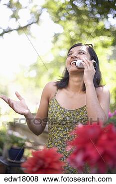 Stock Photo - indian woman talking 
on cell phone. 
fotosearch - search 
stock photos, 
pictures, images, 
and photo clipart