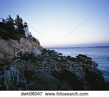 Picture - lighthouse and 
rocky coastline, 
maine. fotosearch 
- search stock 
photos, pictures, 
images, and photo 
clipart