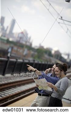 Stock Photography - man giving woman 
directions. fotosearch 
- search stock 
photos, pictures, 
images, and photo 
clipart