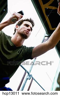 Stock Photography - man hammering 
with mallet. fotosearch 
- search stock 
photos, pictures, 
images, and photo 
clipart