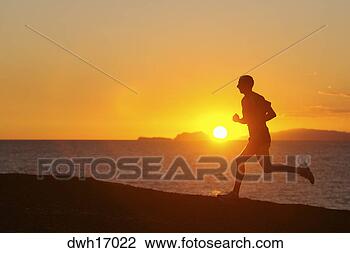 Stock Photo - man jogging along 
shore at sunrise/sunset. 
fotosearch - search 
stock photos, 
pictures, images, 
and photo clipart