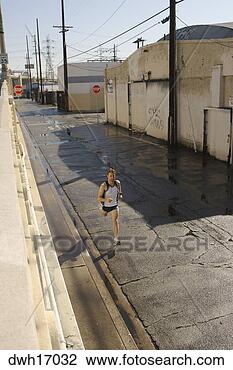 Stock Photo - man jogging on 
urban street. 
fotosearch - search 
stock photos, 
pictures, images, 
and photo clipart