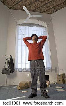 Stock Photography - man with moving 
boxes in office 
space. fotosearch 
- search stock 
photos, pictures, 
images, and photo 
clipart