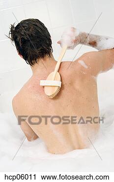 Stock Photography - man scrubbing 
his back. fotosearch 
- search stock 
photos, pictures, 
images, and photo 
clipart