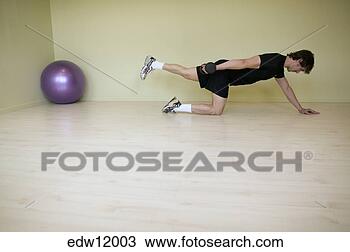 Stock Photo - man stretching 
in empty room. 
fotosearch - search 
stock photos, 
pictures, images, 
and photo clipart