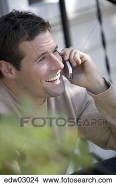 Stock Photo - man talking on 
cell phone. fotosearch 
- search stock 
photos, pictures, 
images, and photo 
clipart