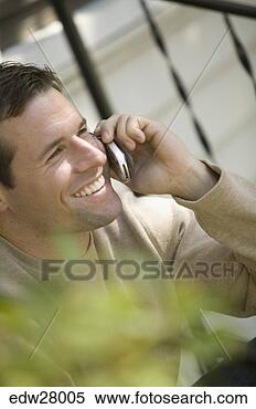 Stock Image - man talking on 
cell phone. fotosearch 
- search stock 
photos, pictures, 
images, and photo 
clipart