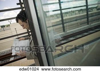 Stock Photo - man waiting for 
train. fotosearch 
- search stock 
photos, pictures, 
images, and photo 
clipart