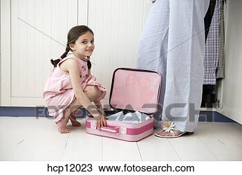 Stock Photo - mother and daughter 
packing suitcase. 
fotosearch - search 
stock photos, 
pictures, images, 
and photo clipart