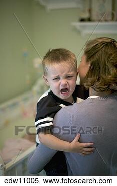 Stock Image - mother holding 
crying toddler. 
fotosearch - search 
stock photos, 
pictures, images, 
and photo clipart