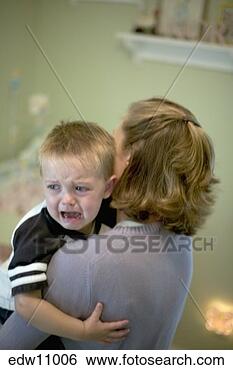 Stock Photo - mother holding 
crying toddler. 
fotosearch - search 
stock photos, 
pictures, images, 
and photo clipart