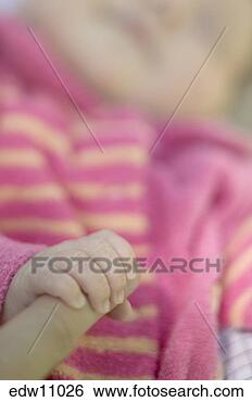 Stock Photo - newborn holding 
adult finger. 
fotosearch - search 
stock photos, 
pictures, images, 
and photo clipart