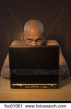 Stock Photography - nude man with 
laptop. fotosearch 
- search stock 
photos, pictures, 
images, and photo 
clipart