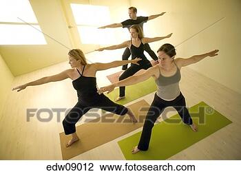 Stock Photo - people practicing 
yoga. fotosearch 
- search stock 
photos, pictures, 
images, and photo 
clipart