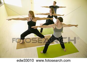 Stock Photography - people practicing 
yoga. fotosearch 
- search stock 
photos, pictures, 
images, and photo 
clipart