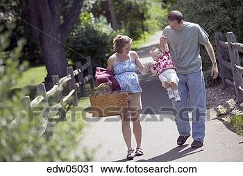 Stock Photography - pregnant woman 
and family having 
picnic. fotosearch 
- search stock 
photos, pictures, 
images, and photo 
clipart