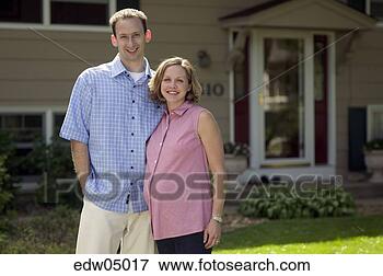 Picture - pregnant woman 
and husband standing 
outside house. 
fotosearch - search 
stock photos, 
pictures, images, 
and photo clipart